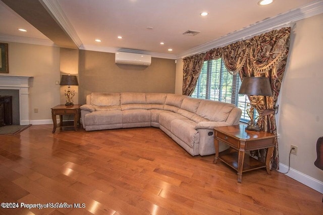 living room with an AC wall unit, crown molding, and light hardwood / wood-style flooring