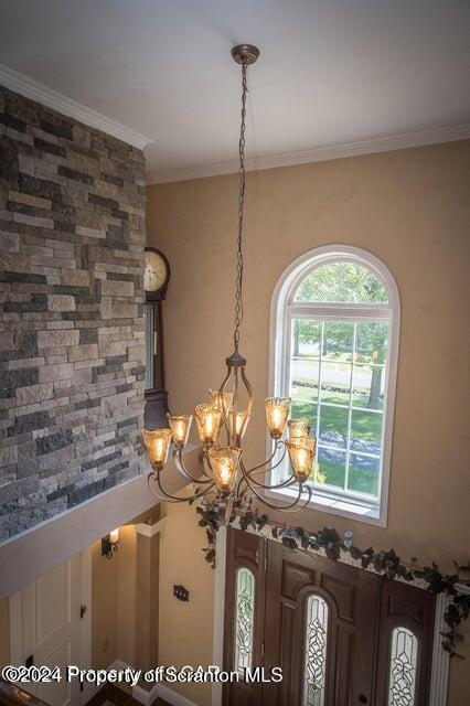 room details featuring a chandelier and ornamental molding