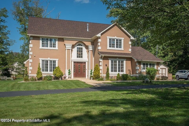 view of front of home with a front lawn