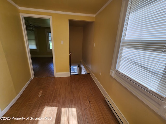 924 Prospect Ave, Scranton, PA 18505 - corridor with an upstairs landing, wood finished floors, crown molding, baseboards, and a baseboard heating unit