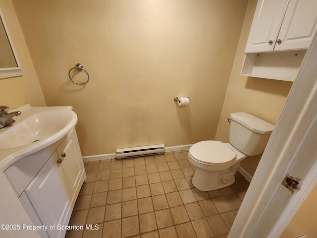 924 Prospect Ave, Scranton, PA 18505 - bathroom with a baseboard radiator, vanity, baseboards, toilet, and tile patterned flooring