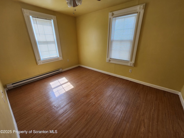 924 Prospect Ave, Scranton, PA 18505 - unfurnished room featuring a baseboard heating unit, wood finished floors, baseboards, and a ceiling fan