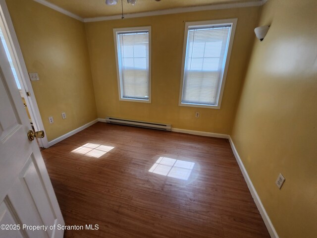 924 Prospect Ave, Scranton, PA 18505 - empty room with a baseboard radiator, wood finished floors, crown molding, and baseboards