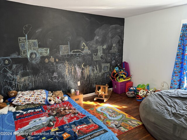 bedroom featuring wood finished floors