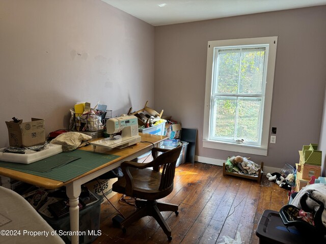 office space with dark wood finished floors and baseboards