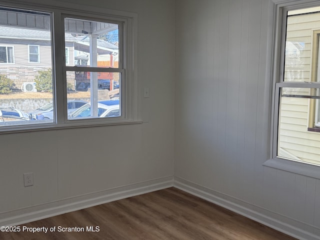 spare room featuring dark wood-type flooring