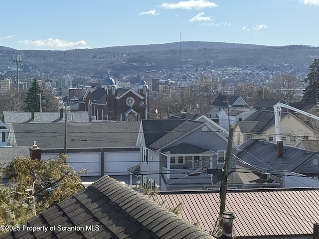 birds eye view of property featuring a mountain view