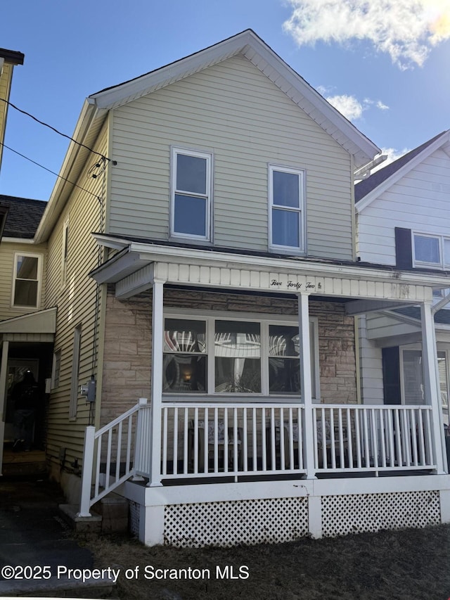 rear view of house with a porch