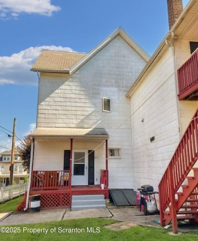 rear view of house with a porch