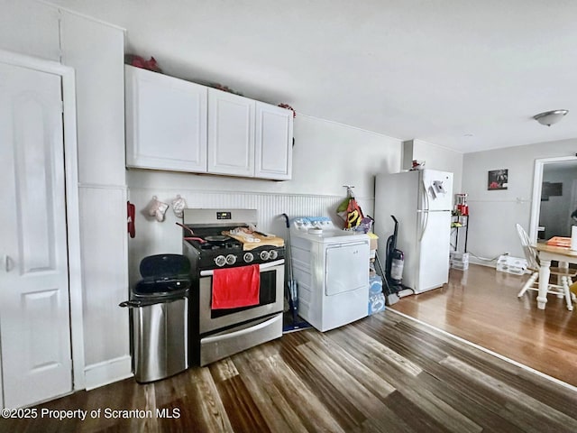 kitchen with white cabinetry, washer / dryer, white refrigerator, gas range, and dark wood-type flooring