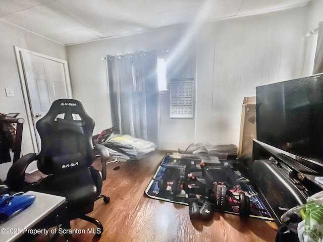 exercise room with hardwood / wood-style floors