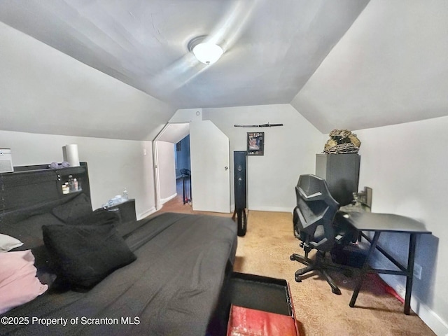 carpeted bedroom featuring vaulted ceiling