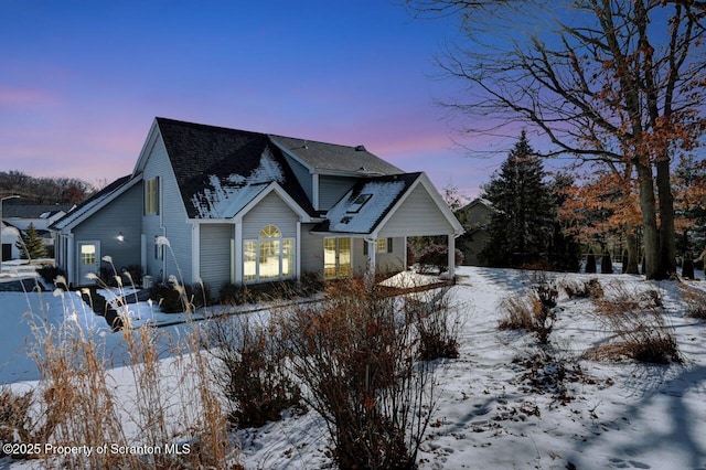 view of front of property featuring roof with shingles