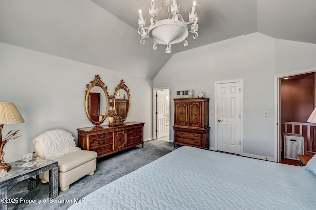 bedroom featuring lofted ceiling, dark carpet, and a notable chandelier