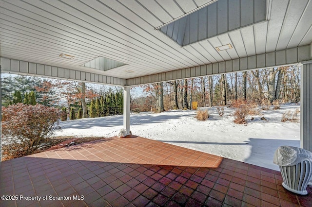 view of snow covered patio