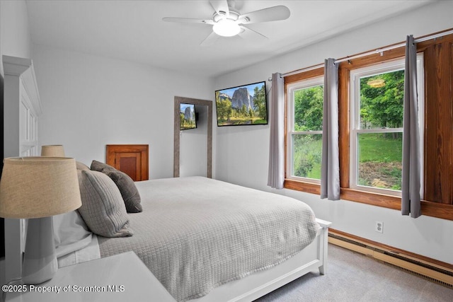 820 Cherry St, Scranton, PA 18505 - carpeted bedroom with baseboard heating and a ceiling fan