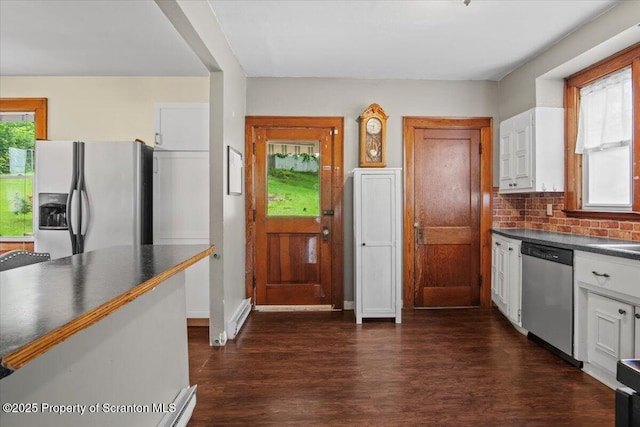 820 Cherry St, Scranton, PA 18505 - kitchen with appliances with stainless steel finishes, dark countertops, dark wood finished floors, backsplash, and white cabinets