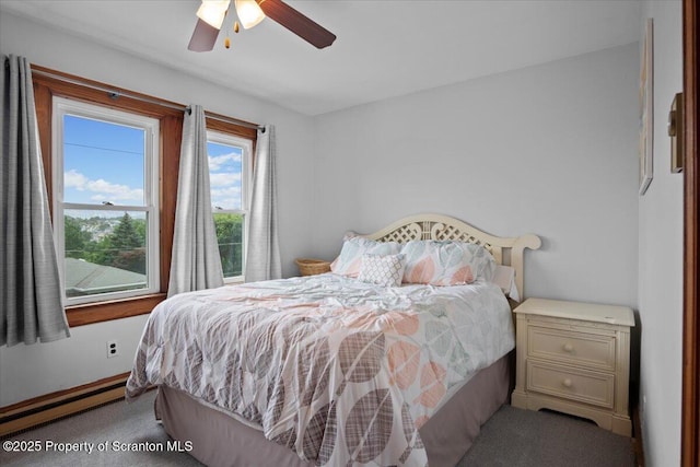 820 Cherry St, Scranton, PA 18505 - carpeted bedroom featuring a baseboard heating unit and ceiling fan