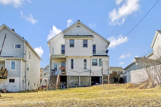 534-536 N Garfield Ave, Scranton, PA 18504 - rear view of house featuring stone siding, fence, stairway, and a yard