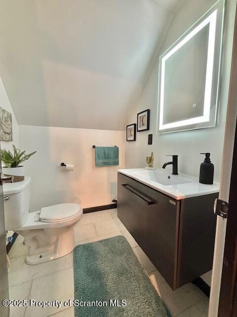 1717 Rolling Hills Dr, Tobyhanna, PA 18466 - half bath featuring lofted ceiling, vanity, and tile patterned flooring