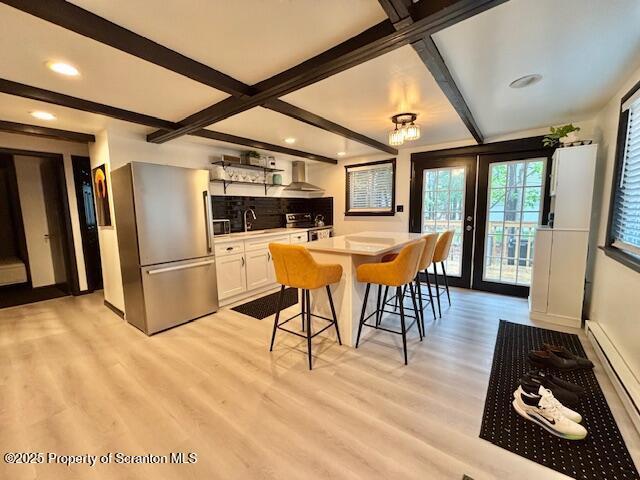 1717 Rolling Hills Dr, Tobyhanna, PA 18466 - dining area with light wood-type flooring, baseboard heating, beamed ceiling, recessed lighting, and coffered ceiling