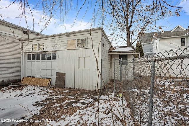 view of snowy exterior featuring fence