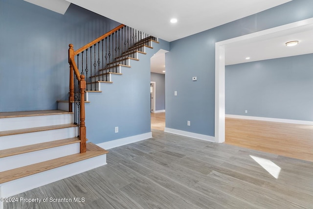 stairs with wood-type flooring