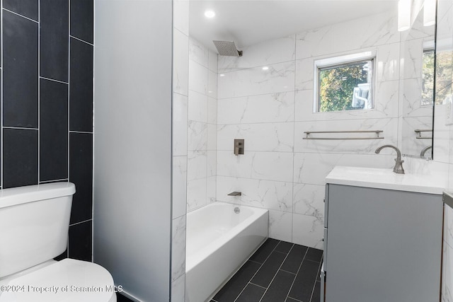 full bathroom featuring vanity, shower / washtub combination, tile patterned flooring, toilet, and tile walls