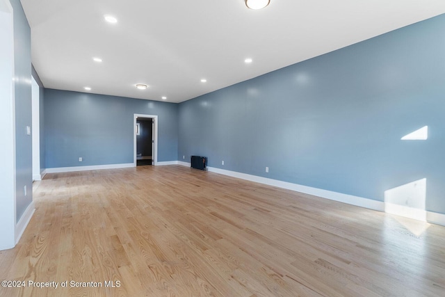 unfurnished room with light hardwood / wood-style flooring