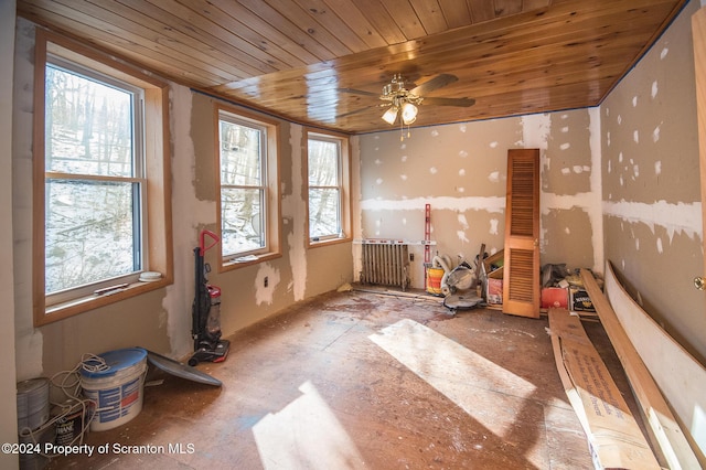 misc room with a wealth of natural light, ceiling fan, and wooden ceiling