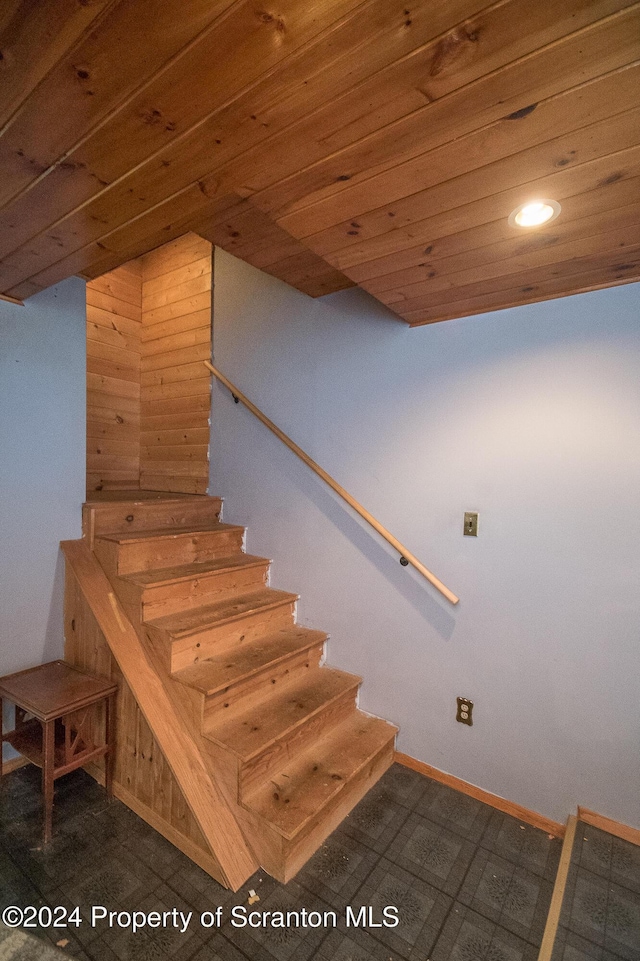 stairs with wooden ceiling