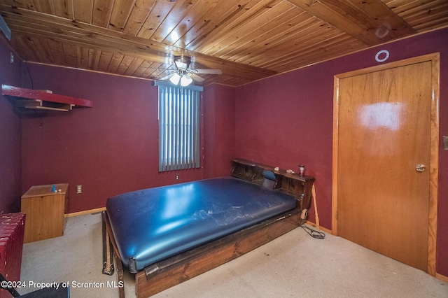 bedroom with wood ceiling, ceiling fan, beamed ceiling, and light colored carpet