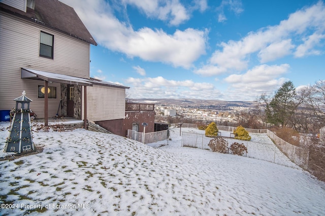 view of yard covered in snow