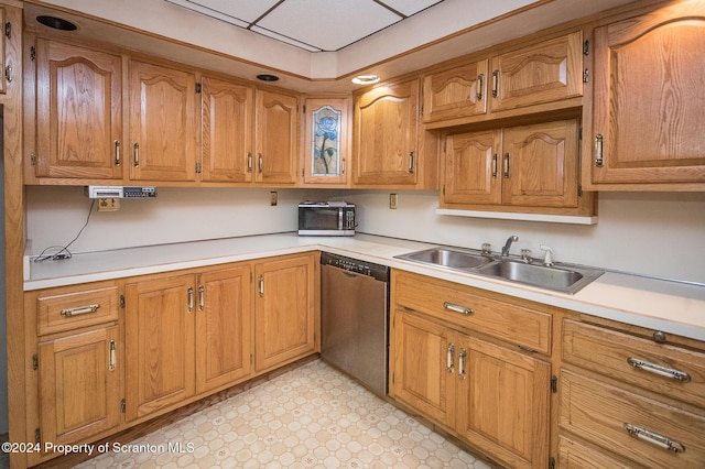 kitchen featuring stainless steel dishwasher and sink