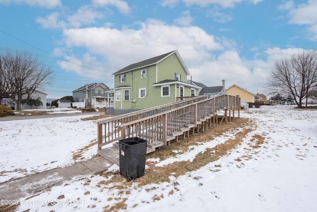 view of snow covered house