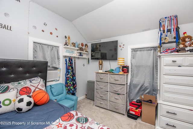 carpeted bedroom with lofted ceiling and radiator