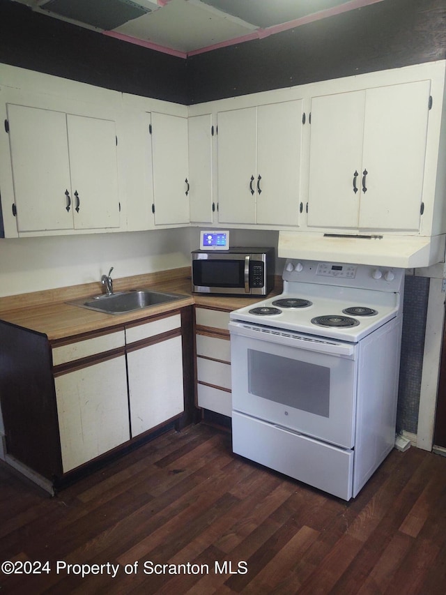 kitchen with sink, white cabinets, dark hardwood / wood-style floors, and white electric range