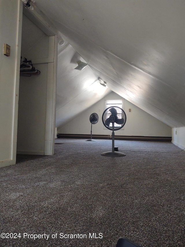 bonus room featuring lofted ceiling and carpet floors