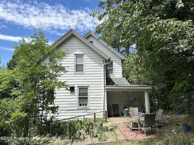 rear view of house featuring a patio