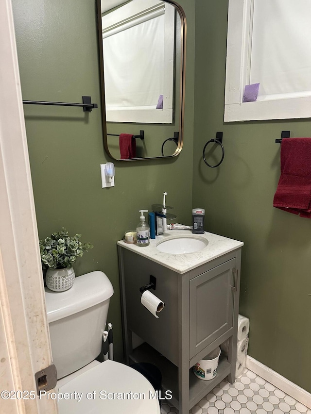 bathroom featuring vanity and toilet