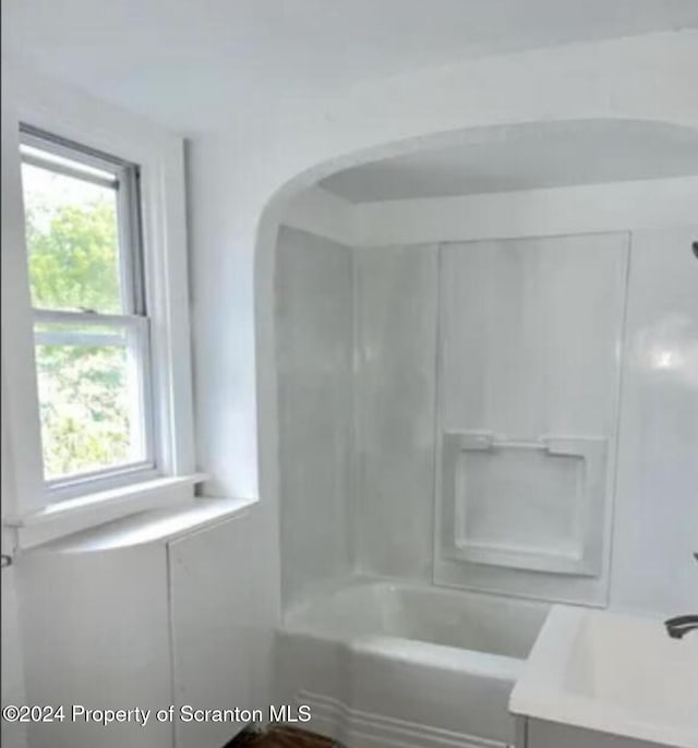 bathroom with vanity and tub / shower combination