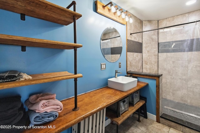 bathroom featuring vanity, tile patterned flooring, and a shower with shower curtain