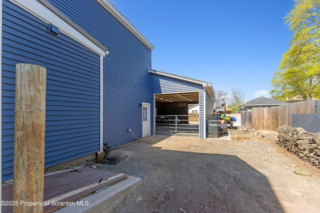view of home's exterior featuring an exterior structure and an outbuilding