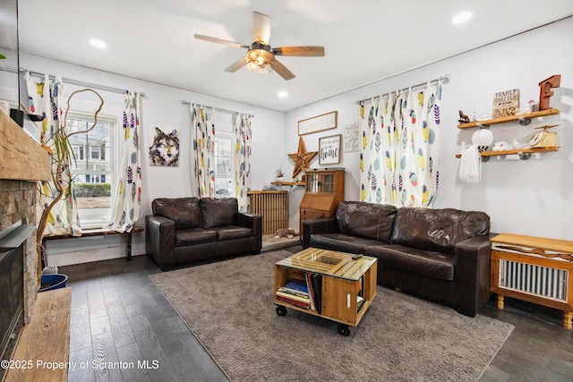 living room featuring recessed lighting, ceiling fan, and wood-type flooring