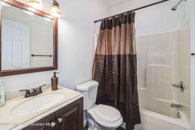 full bathroom featuring shower / bath combination with curtain, vanity, and toilet