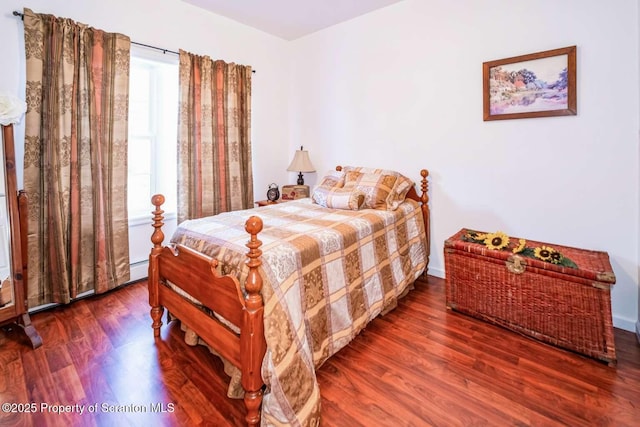 bedroom featuring dark hardwood / wood-style floors