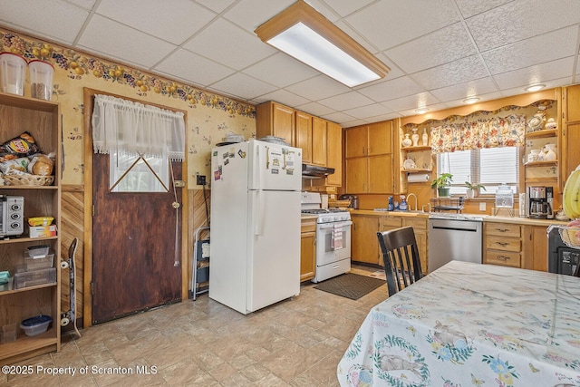 934 W Market St, Scranton, PA 18508 - kitchen with white appliances, open shelves, a paneled ceiling, under cabinet range hood, and light countertops