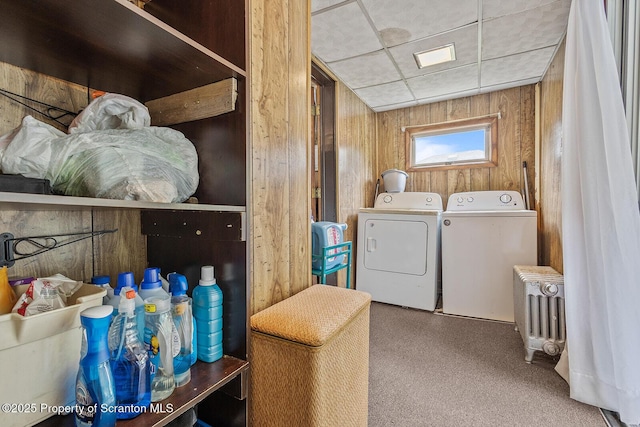 934 W Market St, Scranton, PA 18508 - laundry area featuring wood walls, carpet, radiator heating unit, and washing machine and dryer