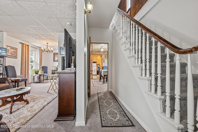 934 W Market St, Scranton, PA 18508 - carpeted entryway featuring stairway and a chandelier