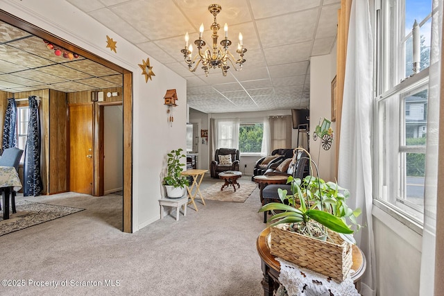 934 W Market St, Scranton, PA 18508 - carpeted living room featuring a chandelier and a paneled ceiling